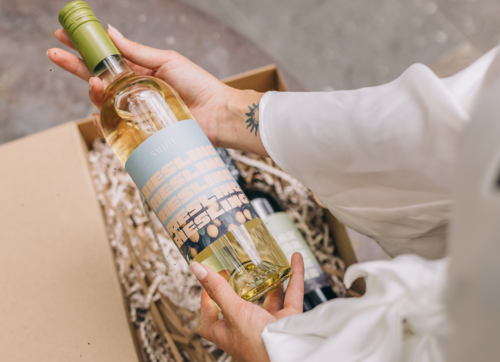 a woman opening a box of wine